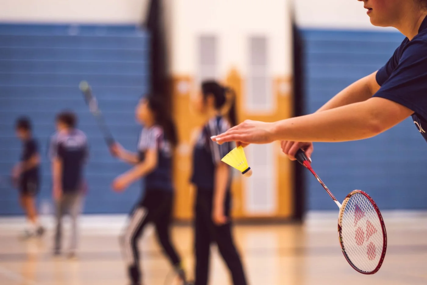 Players enjoying an indoor badminton session